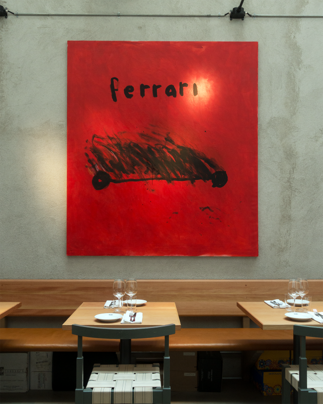 Robert Möllard, Ferrari. Acrylic, ink and oilstick on canvas. A saturated red field with a dark car drawn in a single sweep and the marque brushed by hand above it, hung in an interior.